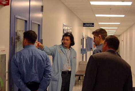 Wafer Processing Engineer, Raita Hoech, leads a tour of the new facility.